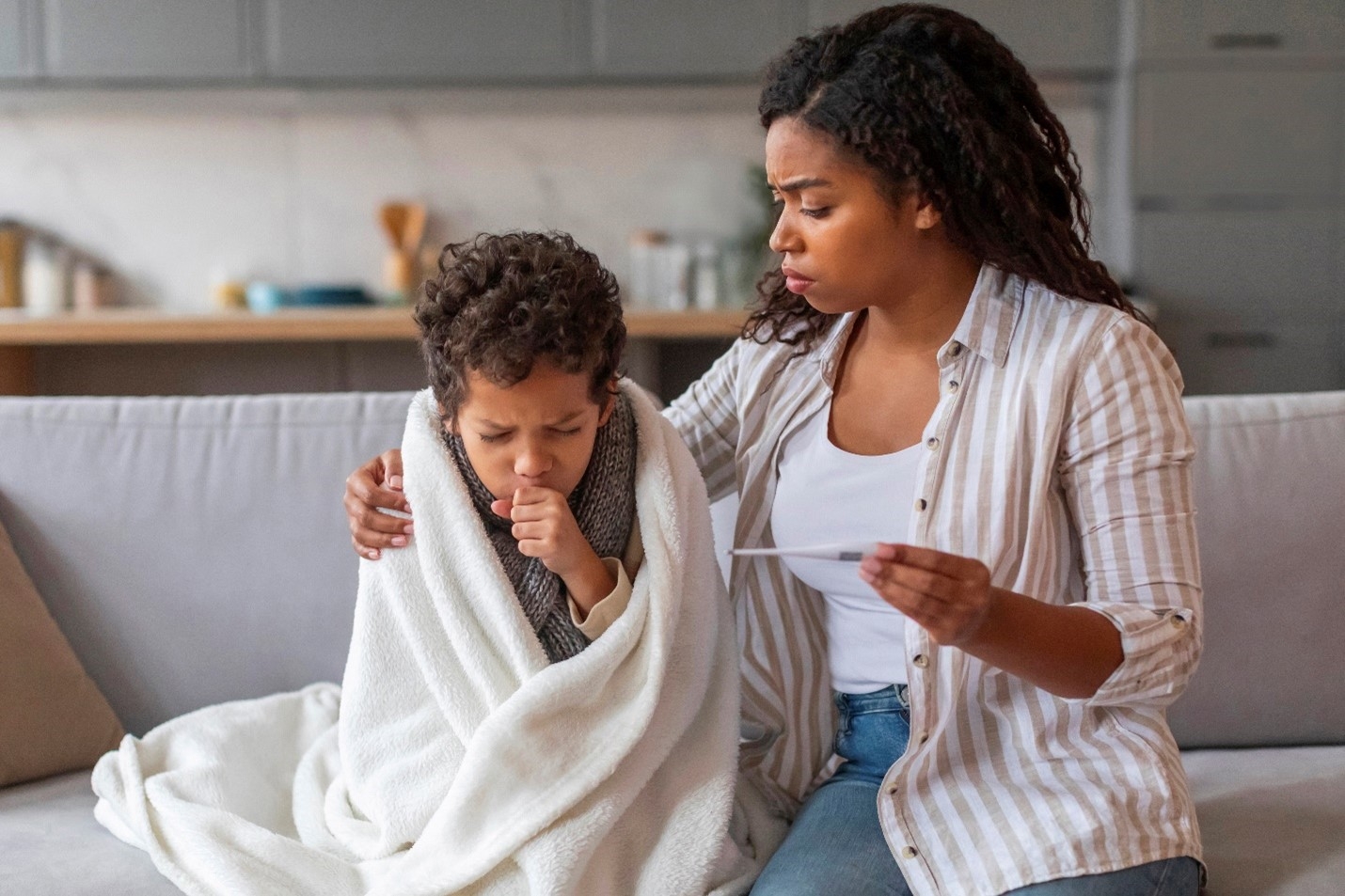 Young child coughing, showing signs of croup 